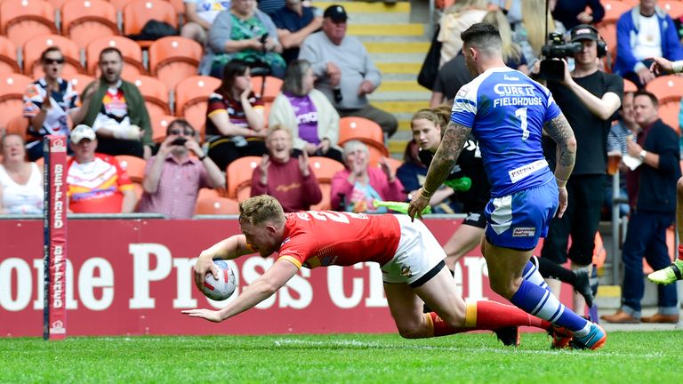 Sheffield's Corey Aston scores a try against Barrow.