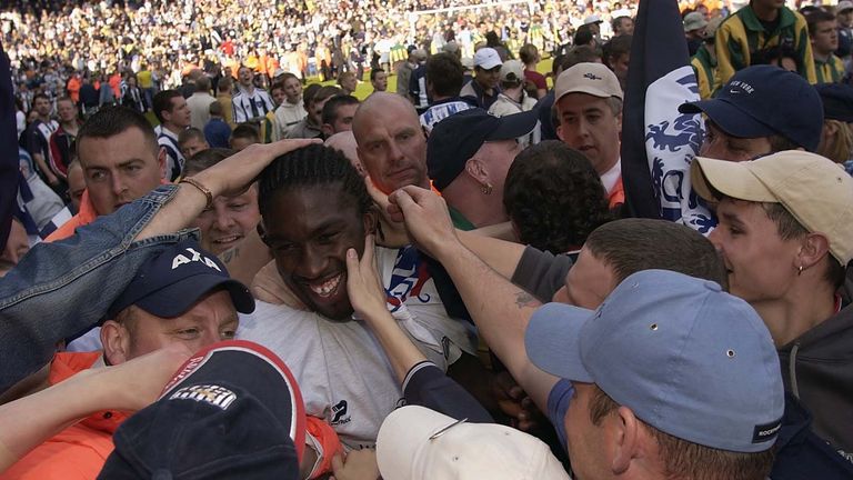 Darren Moore being mobbed by West Brom fans after winning promotion to the Premier League in 2002