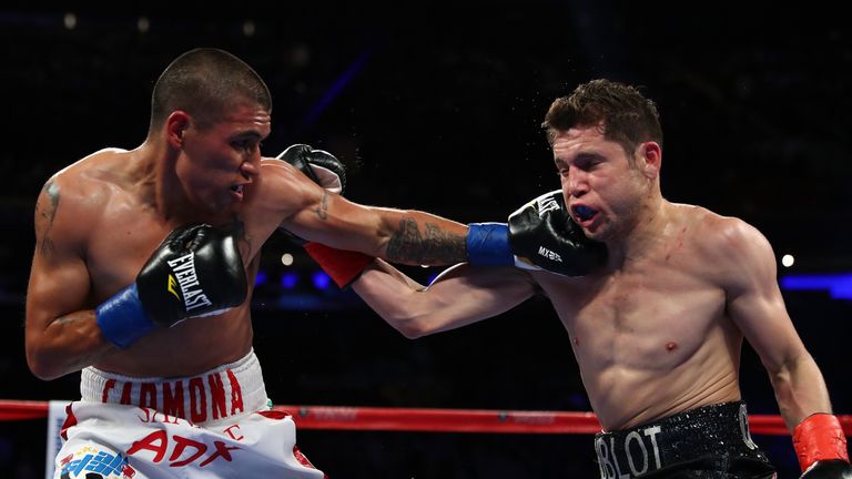 Carlos Cuadras and David Carmona exchange punches during their junior bantamweight bout at Madison Square Garden on March 18, 2017