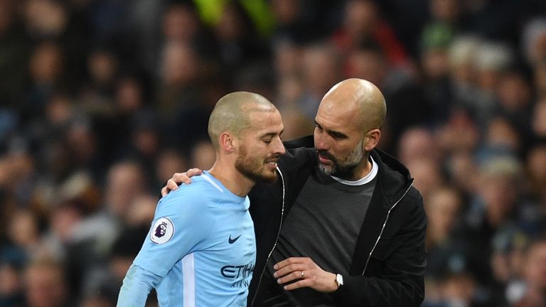 David Silva and Pep Guardiola during the Premier League match between Manchester City and West Bromwich Albion at Etihad Stadium on January 31, 2018 in Manchester, England.