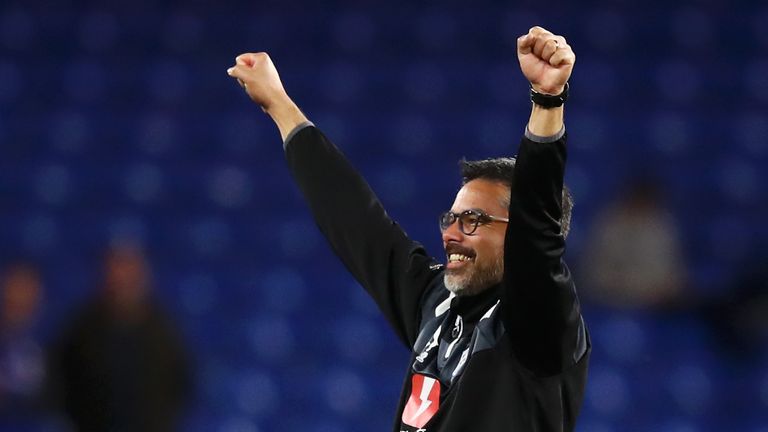 David Wagner celebrates Huddersfield Town's Premier League survival after the match at Stamford Bridge