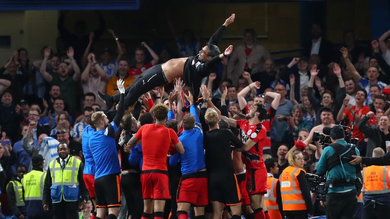 Huddersfield players celebrate their Premier League survival at Stamford Bridge