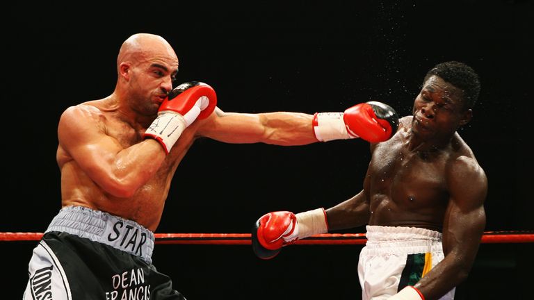 Michael Gbenga (R) takes a blow to the face by Dean Francis during the Commonwealth light heavyweight championship fight at the Bolton Arena on December 8, 2007