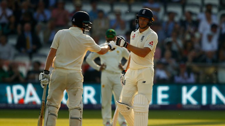 Dom Bess and Jos Buttler of England support each other in their batting partnership during day three of the 1st Test match between England and Pakistan at Lord's Cricket Ground on May 26, 2018 in London, England