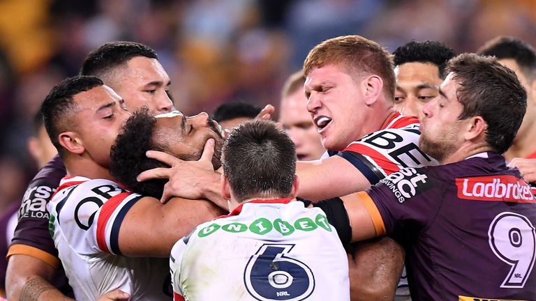 Dylan Napa of the Roosters clashes with Sam Thaiday of the Broncos after Napa was penalised for a high tackle on Korbin Sims