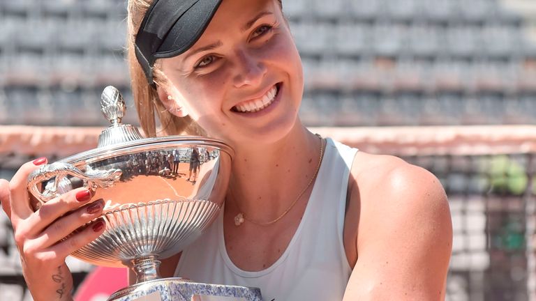 Ukraine's Elina Svitolina poses with the trophy after winning the women's final against Romania's Simona Halep at Rome's WTA Tennis Open tournament at the Foro Italico, on May 20, 2018 in Rome