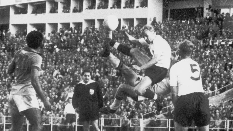 Brazil's Mazzola and England back Don Howe collide in the air during the match in Gothenburg