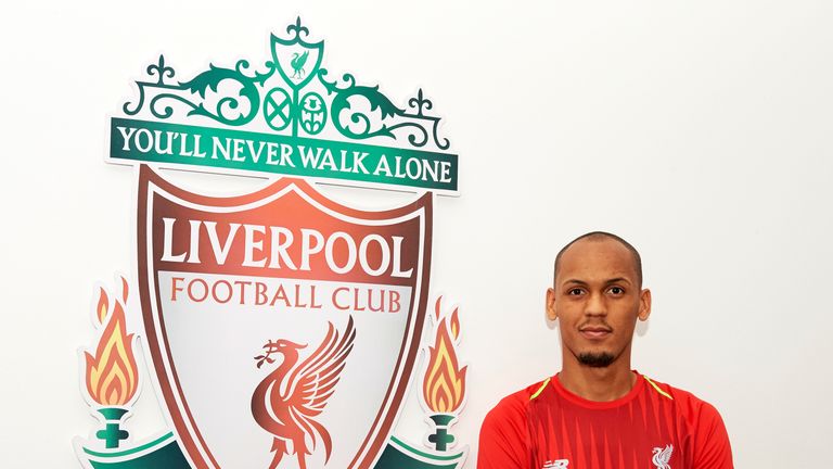 Fabinho poses for photographs at Melwood Training Ground after signing for Liverpool