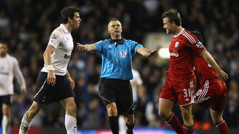 Gareth Bale and Simon Cox are separated by referee Mark Halsey during the Barclays Premier League match between Tottenham Hotspur and West Bromwich Albion at White Hart Lane on January 3, 2012 in London, England.