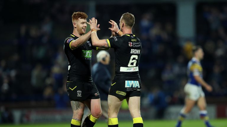 Livett (left) and Kevin Brown celebrate after Warrington's victory at Leeds