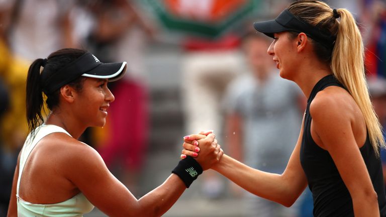 Heather Watson of Great Britain is congratulated on victory by Oceane Dodin of France following their ladies singles first round match during day two of the 2018 French Open at Roland Garros on May 28, 2018 in Paris, France.
