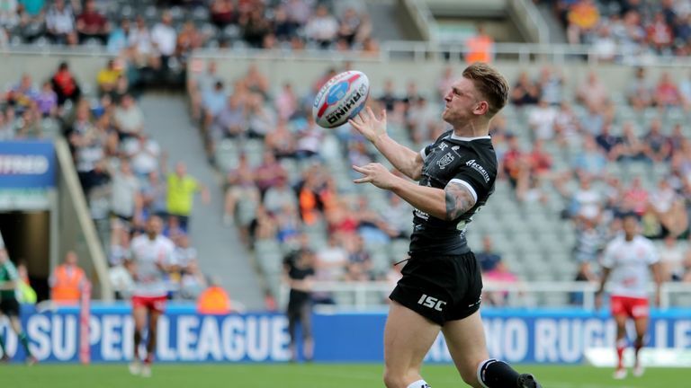 Liam Harris celebrates his try for the Black and Whites