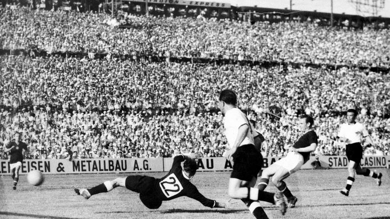 Hungarian forward Nandor Hidegkuti (2nd R) scores the fifth goal for his team past German goalkeeper Heiner Kwiatkowski (22) as Werner Kohlmeyer (C) looks on during the World Cup first-round match between Hungary and West Germany on June 20, 1954 in Basel. Hidegkuti scored twice and his teammate Sandor Kocsis four times as Hungary beat West Germany 8-3