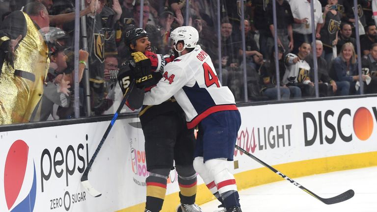 Brooks Orpik (right) checks Ryan Reaves during game one of the Stanley Cup finals