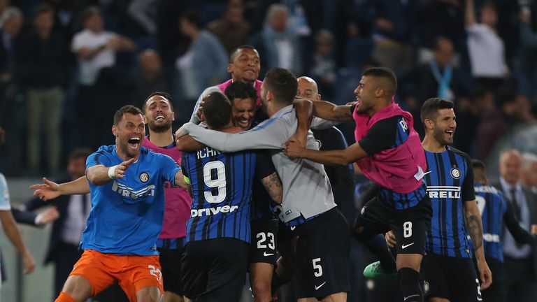 Inter Milan players celebrate after qualifying for the Champions League