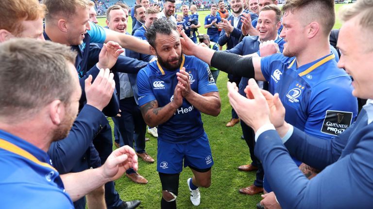 Leinster's Isa Nacewa is cheered off the pitch by teammates.