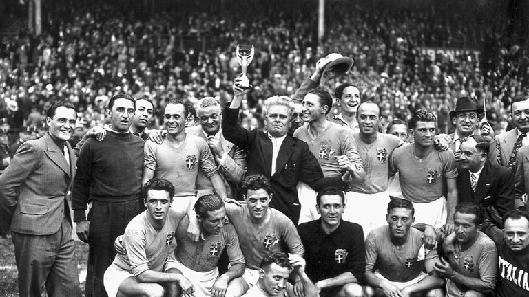 Italy's national soccer team poses with the World Cup trophy after beating Hungary 4-2 in the World Cup final, 19 June 1938 in Colombes, in the suburbs of Paris