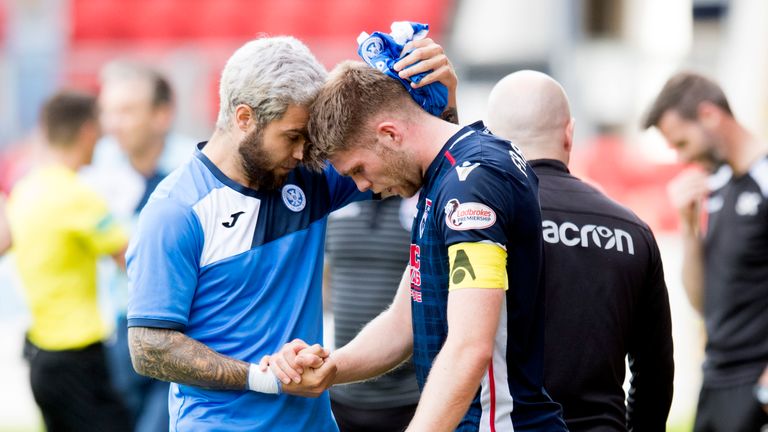 Ross County’s Jason Naismith is consoled by St Johnstone’s Richard Foster