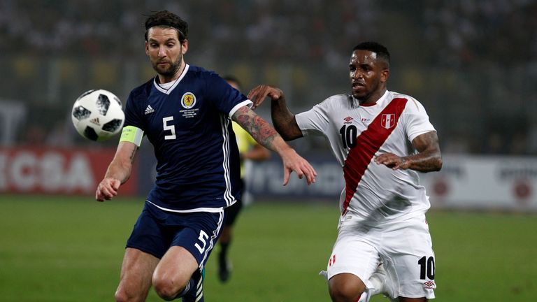 Jefferson Farfan of Peru fights for the ball  against Charlie Mulgrew of Scotland during the international friendly