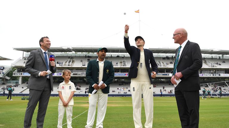 Joe Root tosses the coin during day one of the 1st Test match between England and Pakistan at Lord's Cricket Ground on May 24, 2018 in London, England.