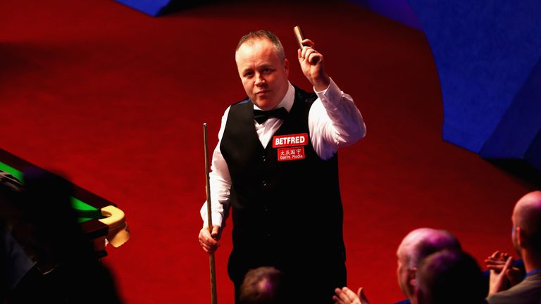John Higgins of Scotland celebrates after winning his first round match against Thepchaiya Un-Nooh of Thailand during day five of the World Snooker Championship at Crucible Theatre on April 25, 2018 in Sheffield, England