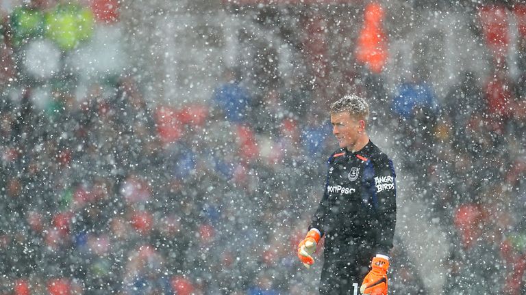 Jordan Pickford in the snow during a Premier League match at the bet365 Stadium in Stoke on March 17, 2018