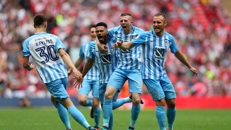 Jordan Willis of Coventry City celebrates with team-mates after scoring their side's first goal