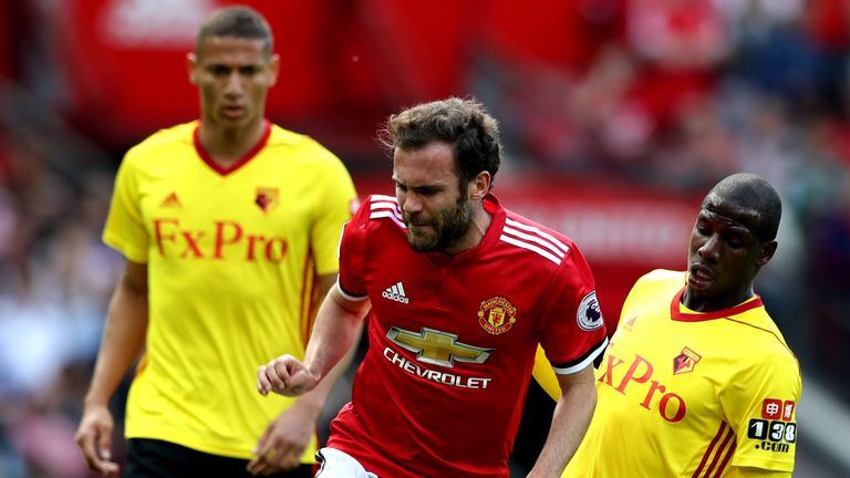 Juan Mata is tackled by Abdoulaye Doucoure