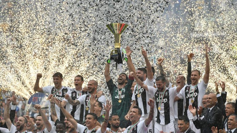 Gianluigi Buffon lifts the Serie A trophy following his final Juventus appearance 