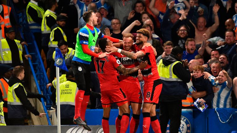 Laurent Depoitre (C) celebrates with teammates after giving Huddersfield the lead at Stamford Bridge