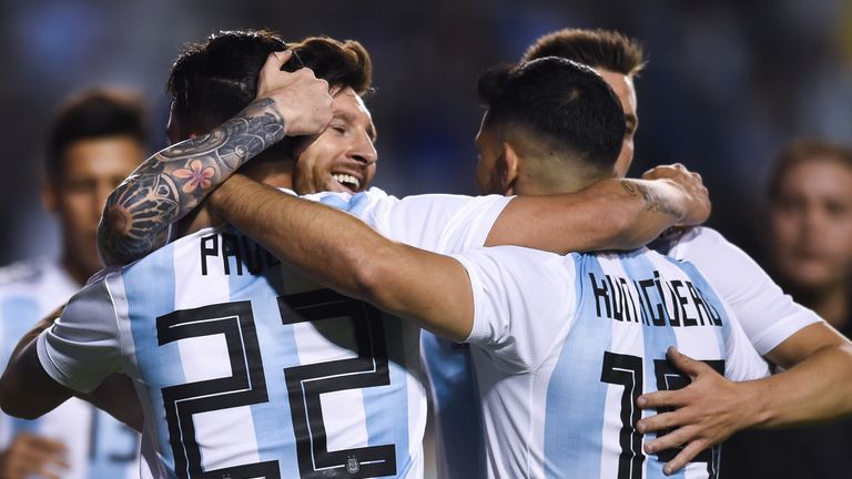 Lionel Messi celebrates with his team-mates after scoring against Haiti