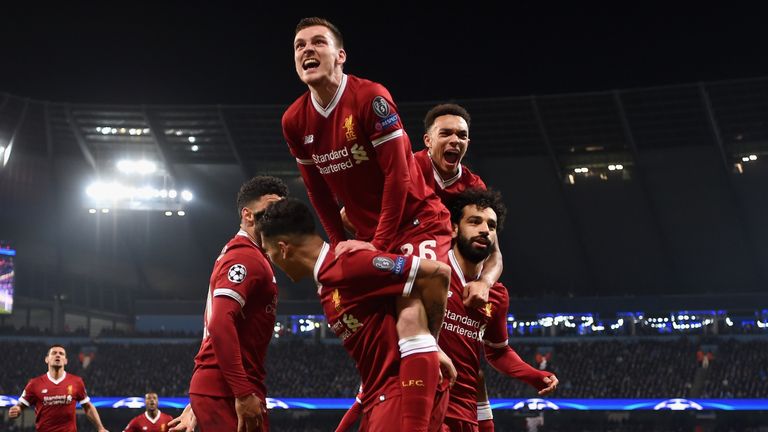 MANCHESTER, ENGLAND - APRIL 10:  Andy Robertson of Liverpool joins in as Liverpool players celebrate after their side's first goal during the UEFA Champions League Quarter Final Second Leg match between Manchester City and Liverpool at Etihad Stadium 