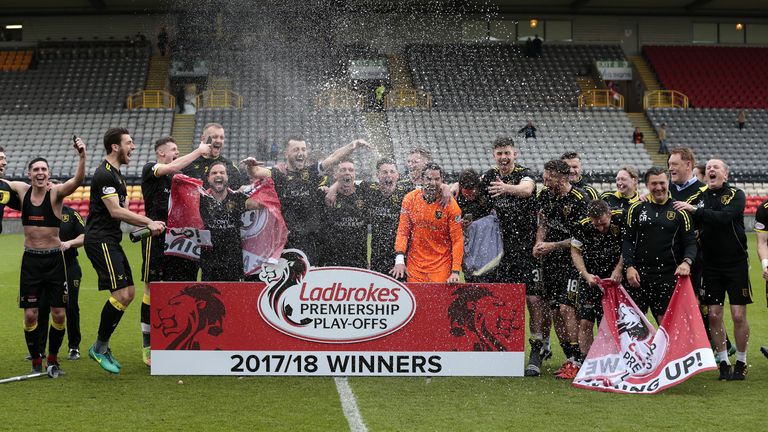 Livingston celebrate after their promotion to the Scottish Premiership