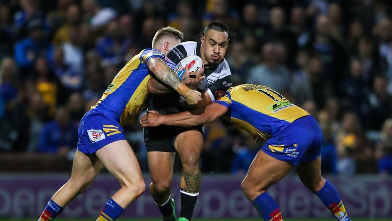 Mahe Fonua is tackled by Leeds' Jamie Jones-Buchanan and Liam Sutcliffe.