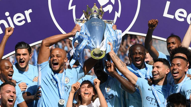 Vincent Kompany lifts the Premier League trophy as Manchester City are crowned Premier League champions at the Etihad Stadium