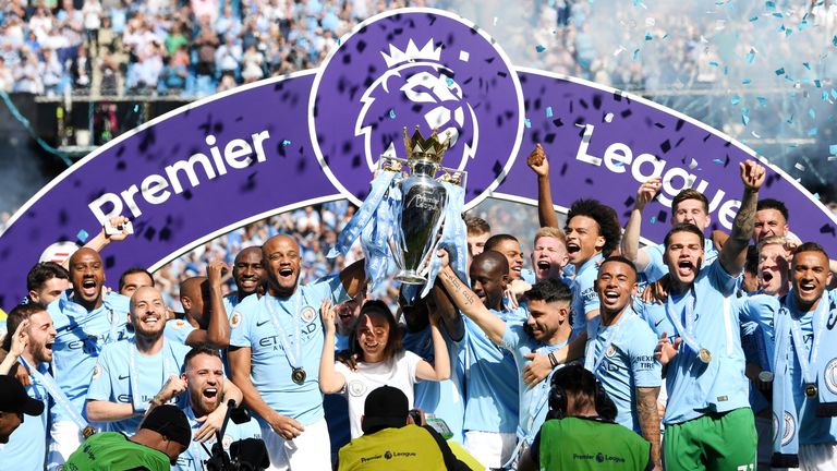 Vincent Kompany lifts the Premier League trophy as Manchester City are crowned Premier League champions at the Etihad Stadium