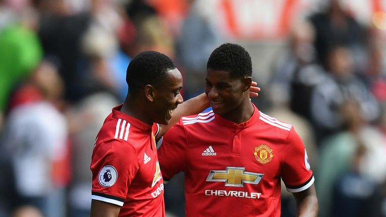 Marcus Rashford and Anthony Martial celebrate during the Premier League match between Swansea City and Manchester United at Liberty Stadium on August 19, 2017 in Swansea, Wales.