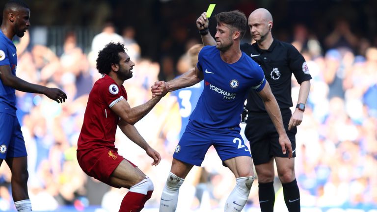 Mohamed Salah is shown a yellow card for diving against Chelsea at Stamford Bridge