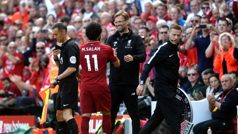 Jurgen Klopp shakes hands with Mohamed Salah as he comes off for Ben Woodburn (not pictured)