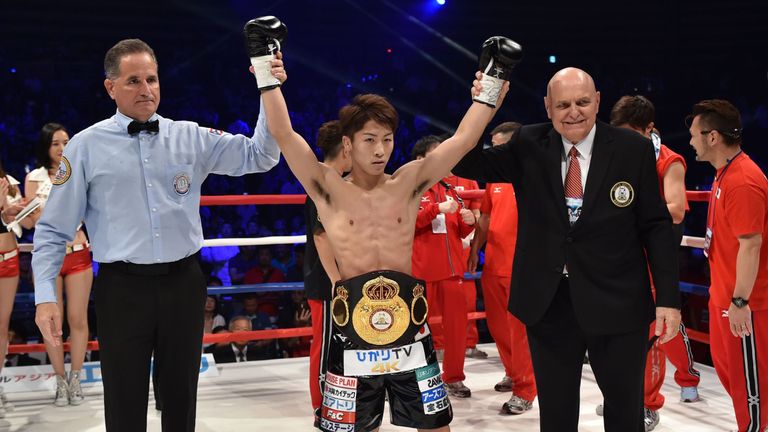 Naoya Inoue celebrates becoming WBA world bantamweight champion after his first round defeat of Jamie McDonnell 