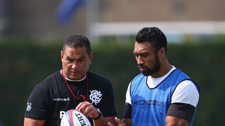 Pat Lam (L)  coach of the Barbarians gives instructions to Victor Vito