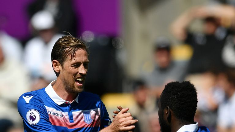 Peter Crouch celebrates with Mame Biram Diouf after scoring Stoke City's second goal 