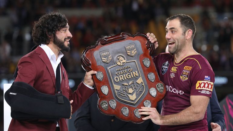 Johnathan Thurston and Cameron Smith of the Maroons hold aloft the Origin trophy after winning game three of the 2017 State Of Origin series 
