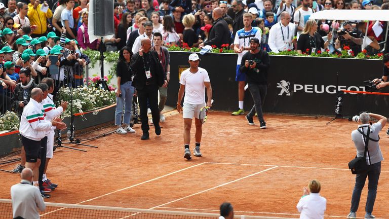 Rafael Nadal (C) of Spain arrives for an exhibition on an outside court during day two of the Internazionali BNL d'Italia 2018 tennis at Foro Italico on May 14, 2018 in Rome, Italy.