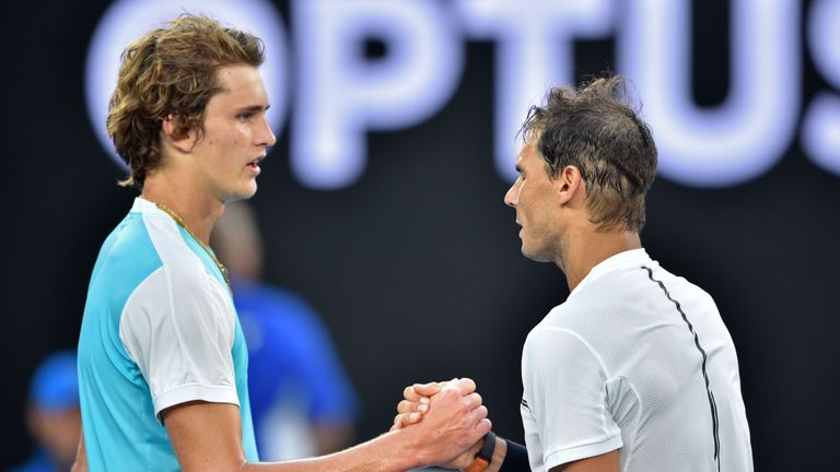 Spain's Rafael Nadal (R) shakes hands with Germany's Alexander Zverev after winning their men's singles third round match on day six of the Australian Open tennis tournament in Melbourne on January 21, 2017.