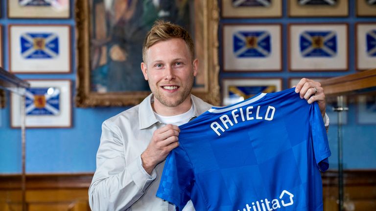 New Rangers signing Scott Arfield poses with the shirt