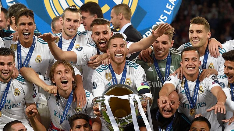 Real Madrid celebrate with the Champions League trophy after their 3-1 win over Liverpool