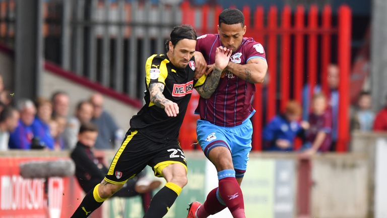 Rotherham United's Ryan Williams (left) and Scunthorpe United's Jordan Clarke battle for the ball