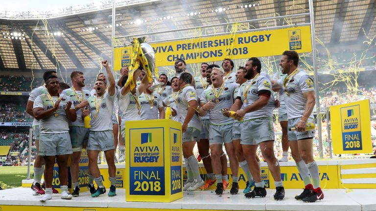 Brad Barritt of Saracens lifts the Aviva Premiership trophy following his side's victory during the Final v Exeter Chiefs at Twickenham Stadium