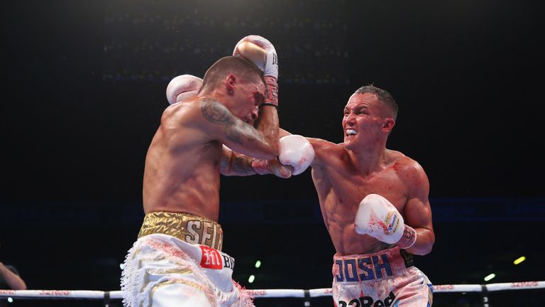 Lee Selby lands a shot on Josh Warrington during IBF Featherweight Championship fight at Elland Road on May 19, 2018 in Leeds, England.